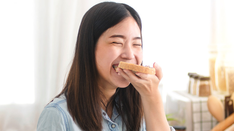 woman eating toast