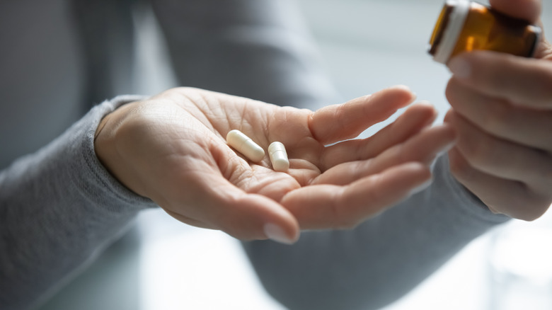 Pills in a woman's hand