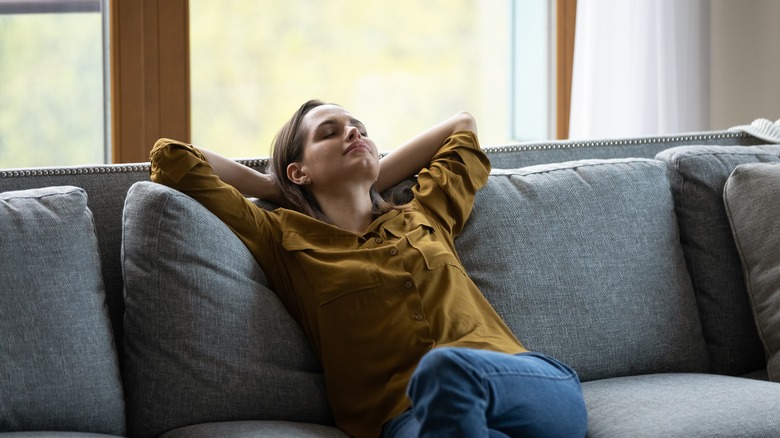 Woman relaxing on couch