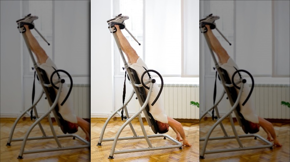 man using inversion table 