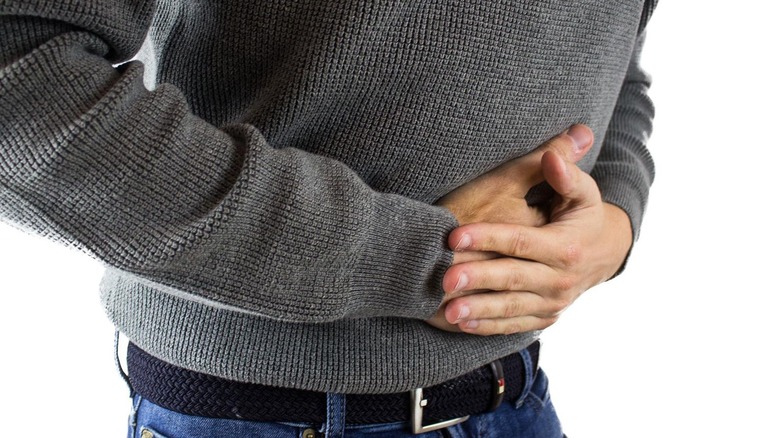 Person holding stomach