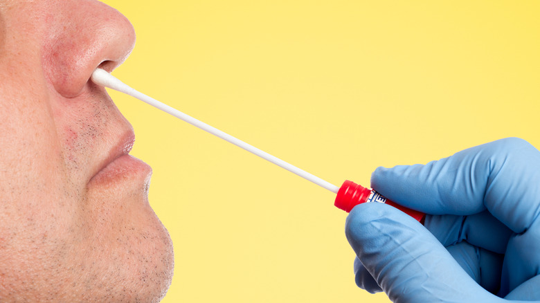 man getting nose swab