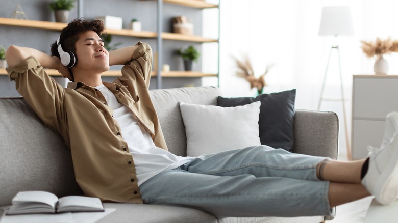 Smiling man listening to music