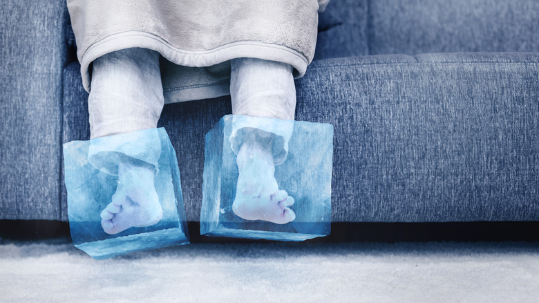 Close up of feet in ice blocks