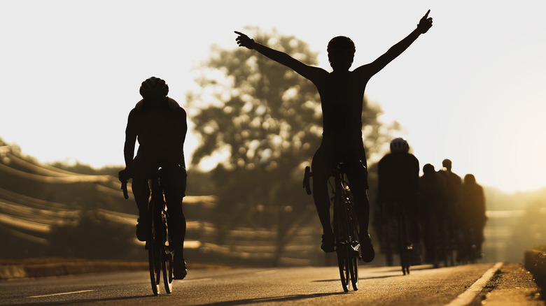 group of bike riders at sunset