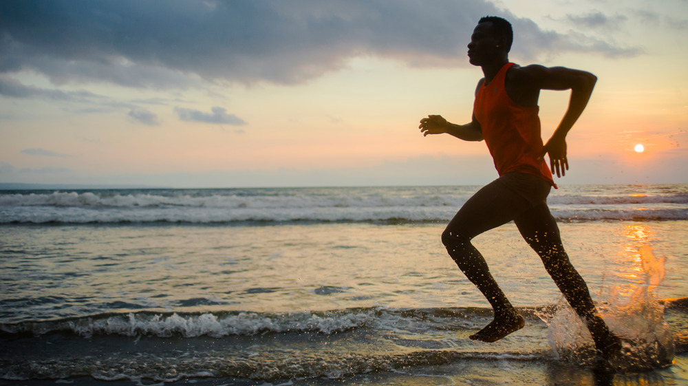man running barefoot