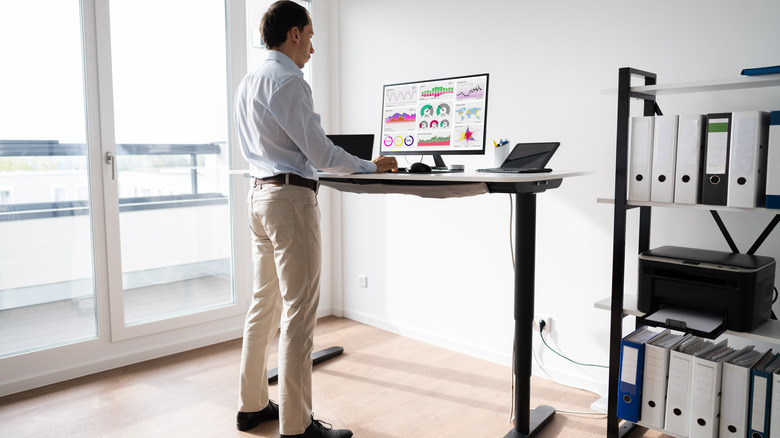 Man working at a standing desk
