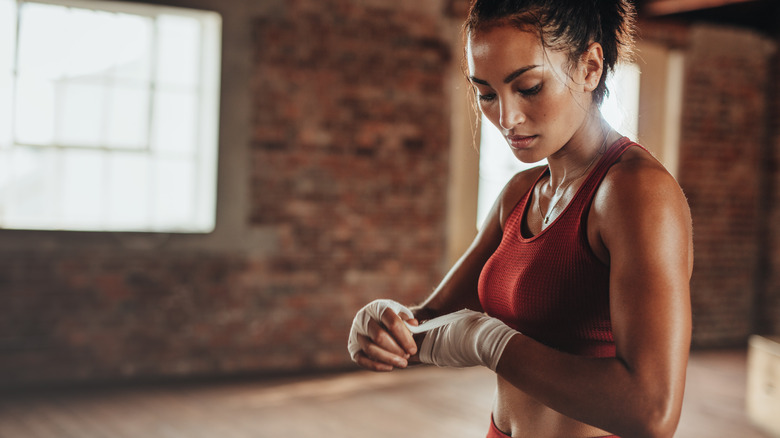 Woman kickboxing at gym