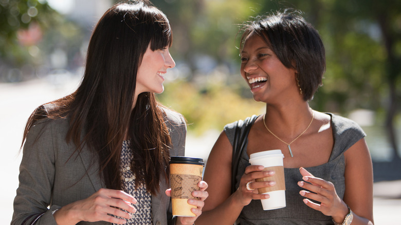 Two women drinking coffee