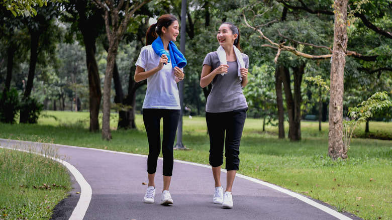 women walking in park