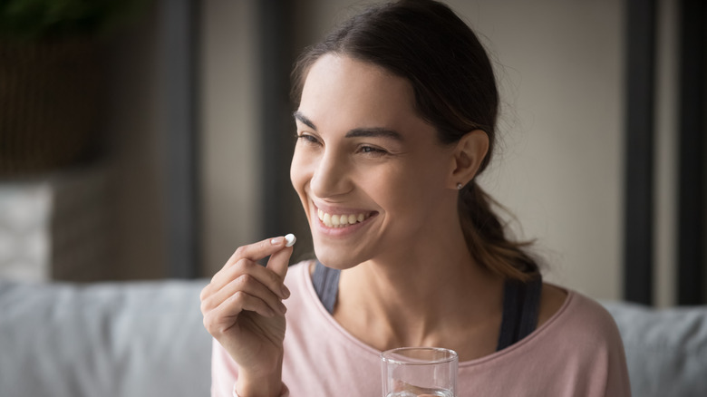 Woman taking medication