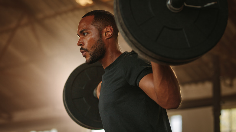 Man lifting weights in a gym