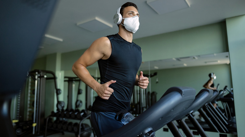 man running on treadmill