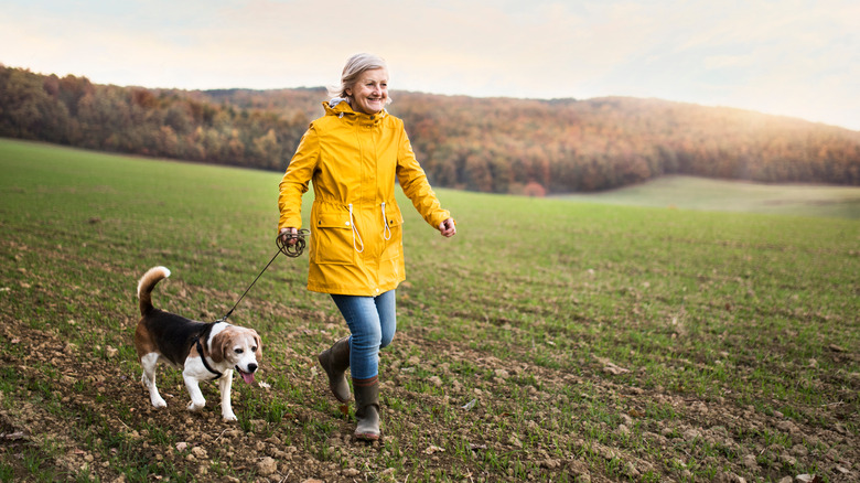 A woman walks her dog