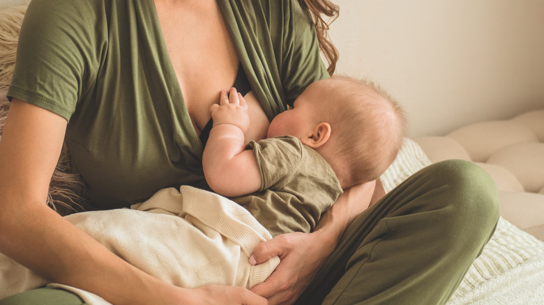 woman breastfeeding baby