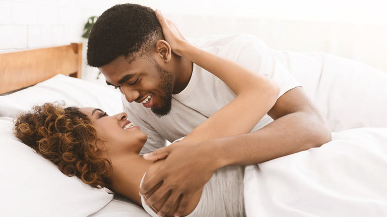 african american couple in bed
