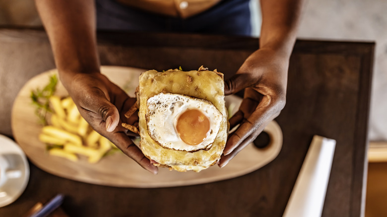 Woman eating eggs
