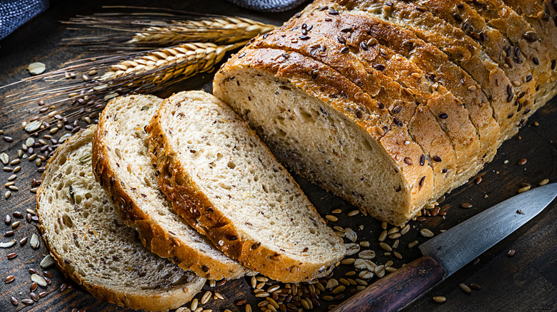 sliced whole grain bread on a wood table