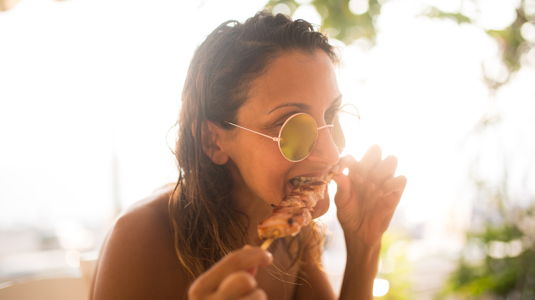 Woman eating meat