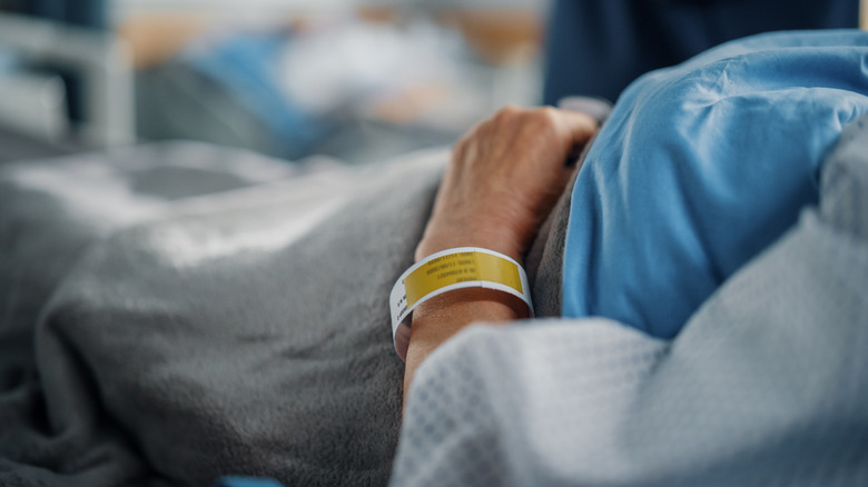 Patient laying in hospital bed