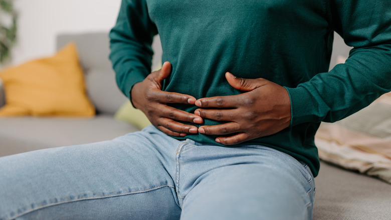 person holding stomach