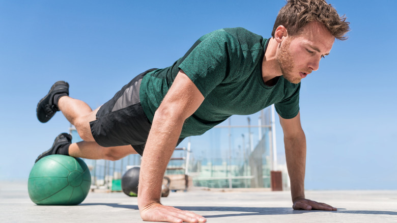 man doing incline pushup