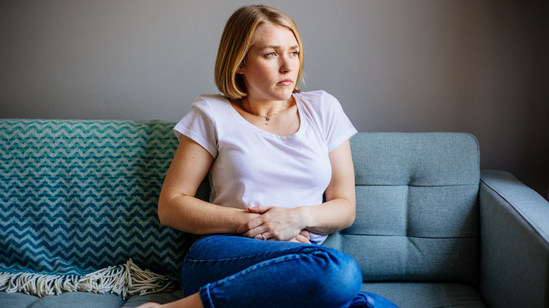 Woman holding her stomach