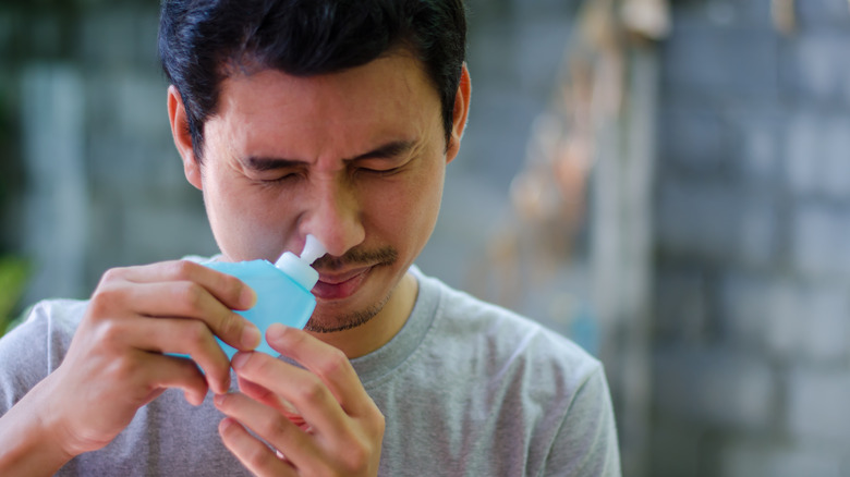 Man using neti pot