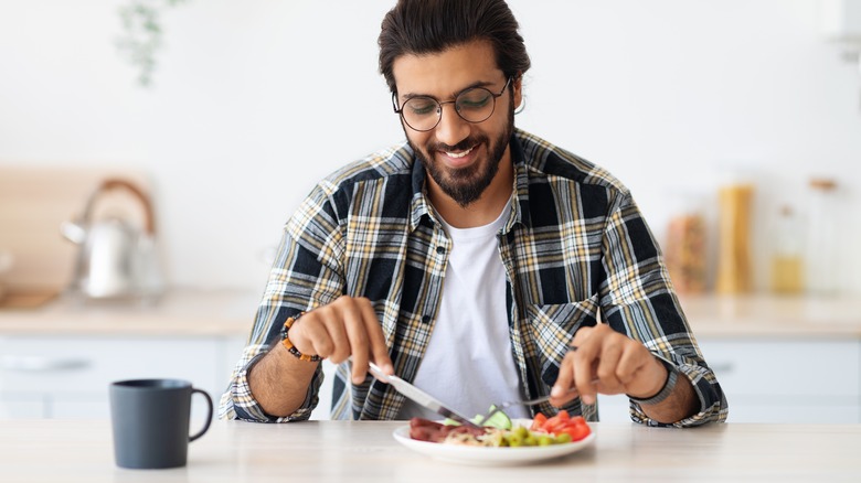 A man eats dinner