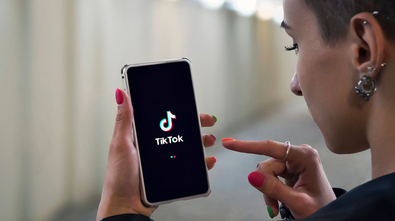 Person using TikTok on phone