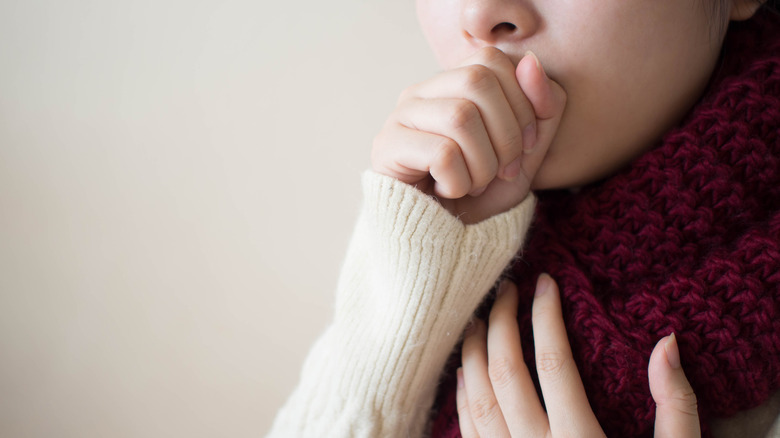 young woman coughing