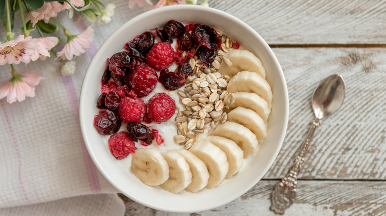 bowl of berries, bananas, and oats