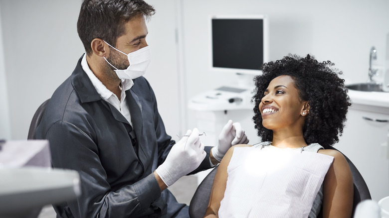 dentist examining patient's mouth