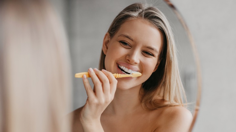woman brushing teeth
