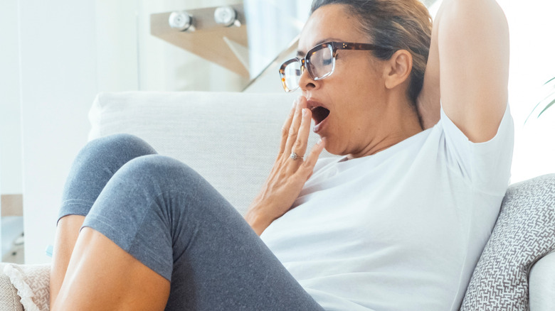 woman yawning and ready to get sleep