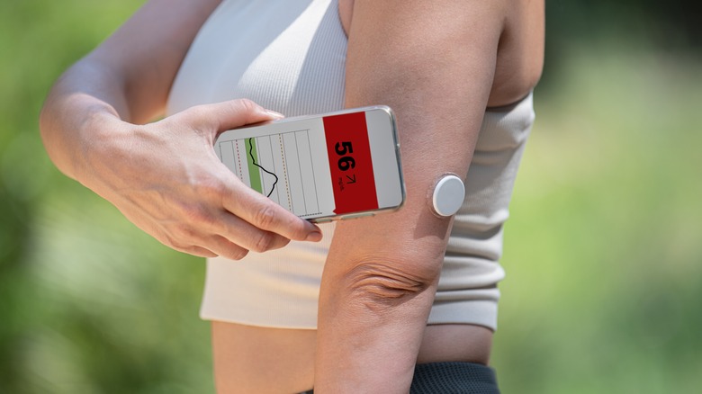 A woman monitors her blood sugar