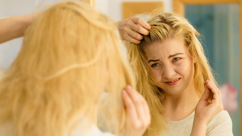 Woman looking at hair