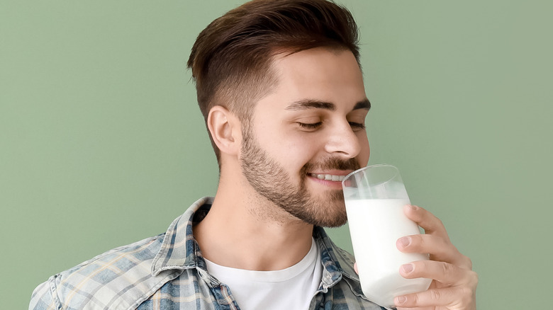 man with glass of milk