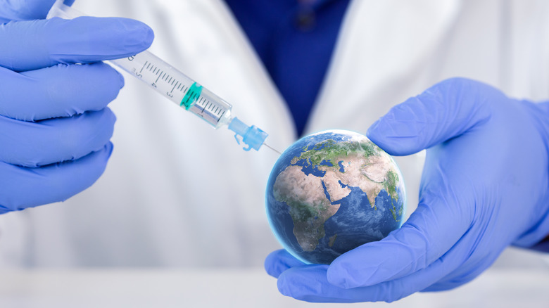 Doctor injecting vaccine into the globe
