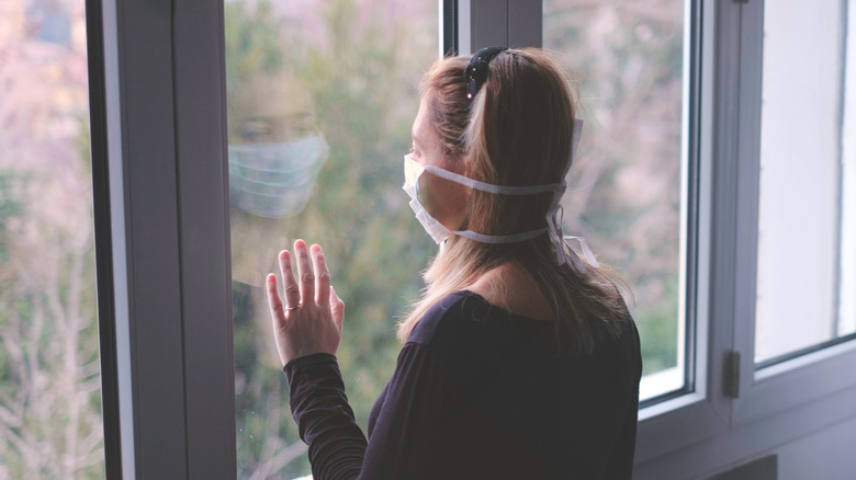 woman looking out of the window