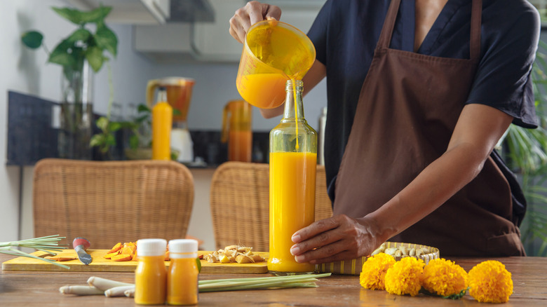 Woman preparing Jamu juice 