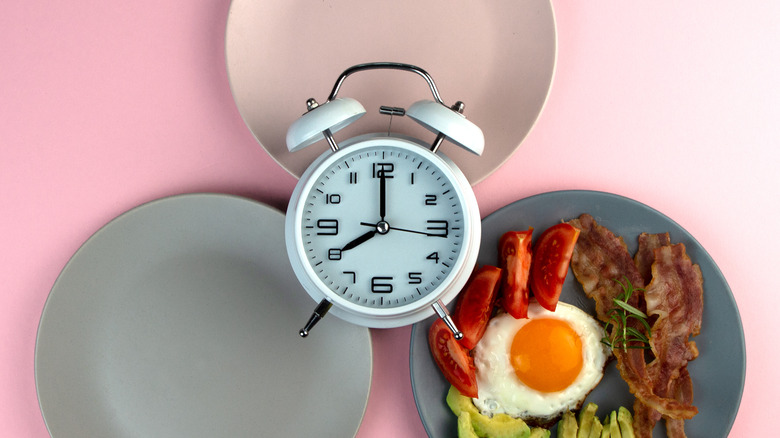 Plates and clock representing fasting