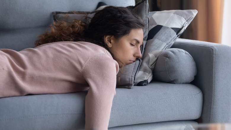 Person napping on couch
