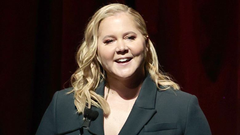 Smiling Amy Schumer at public speaking event