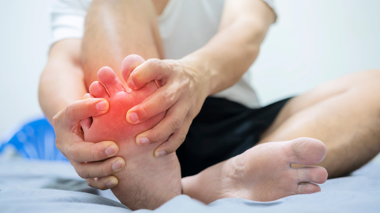 man with foot pain