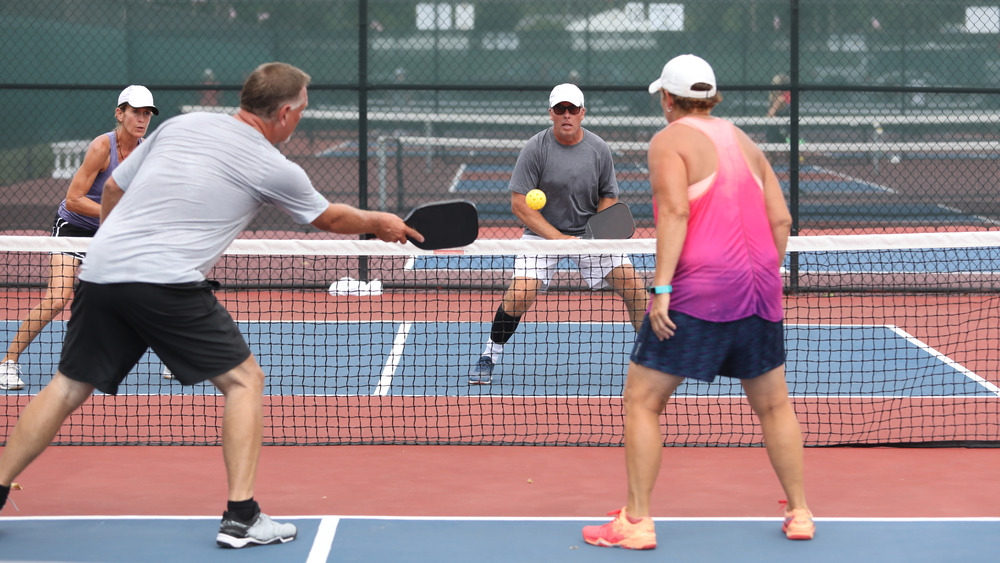 Four players in pickleball game