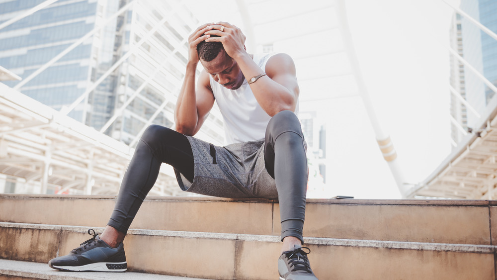 runner with head in his hands