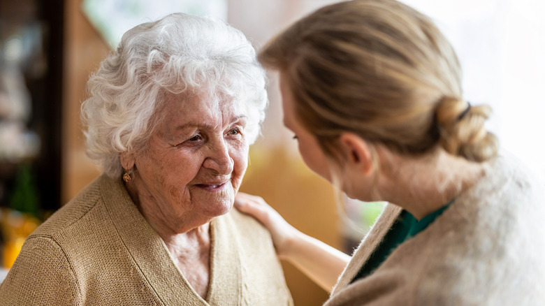woman comforting a senior woman