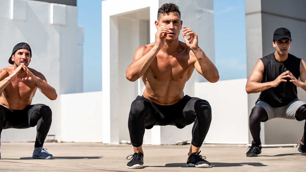 men doing squats