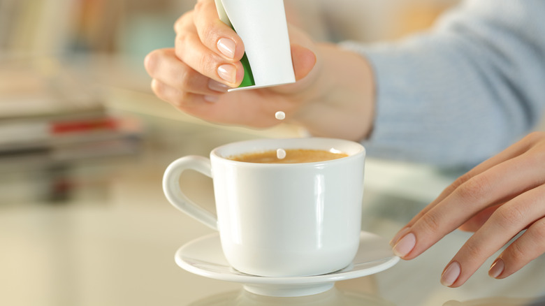 stevia tablets being put in coffee